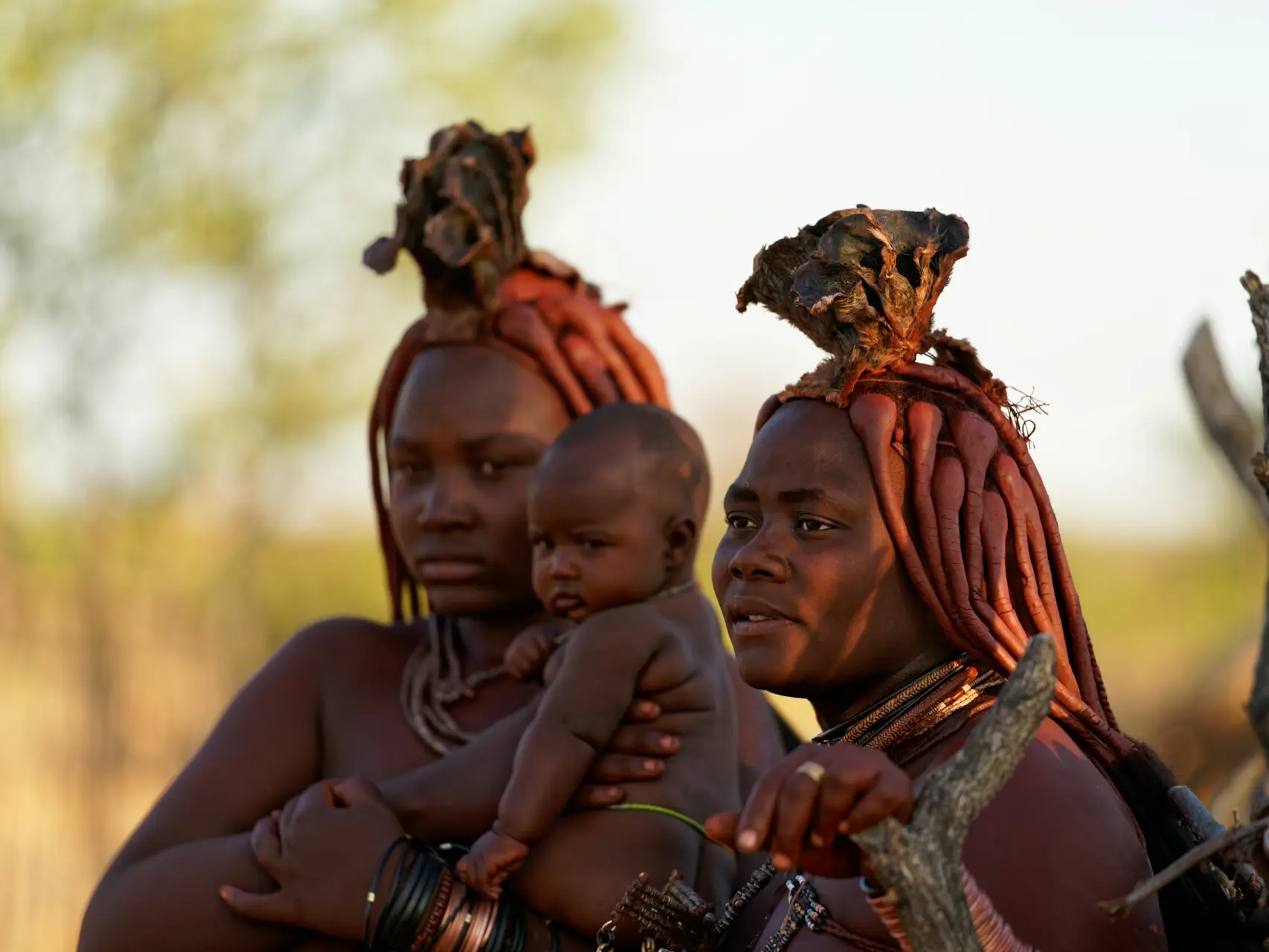 a person carrying a baby