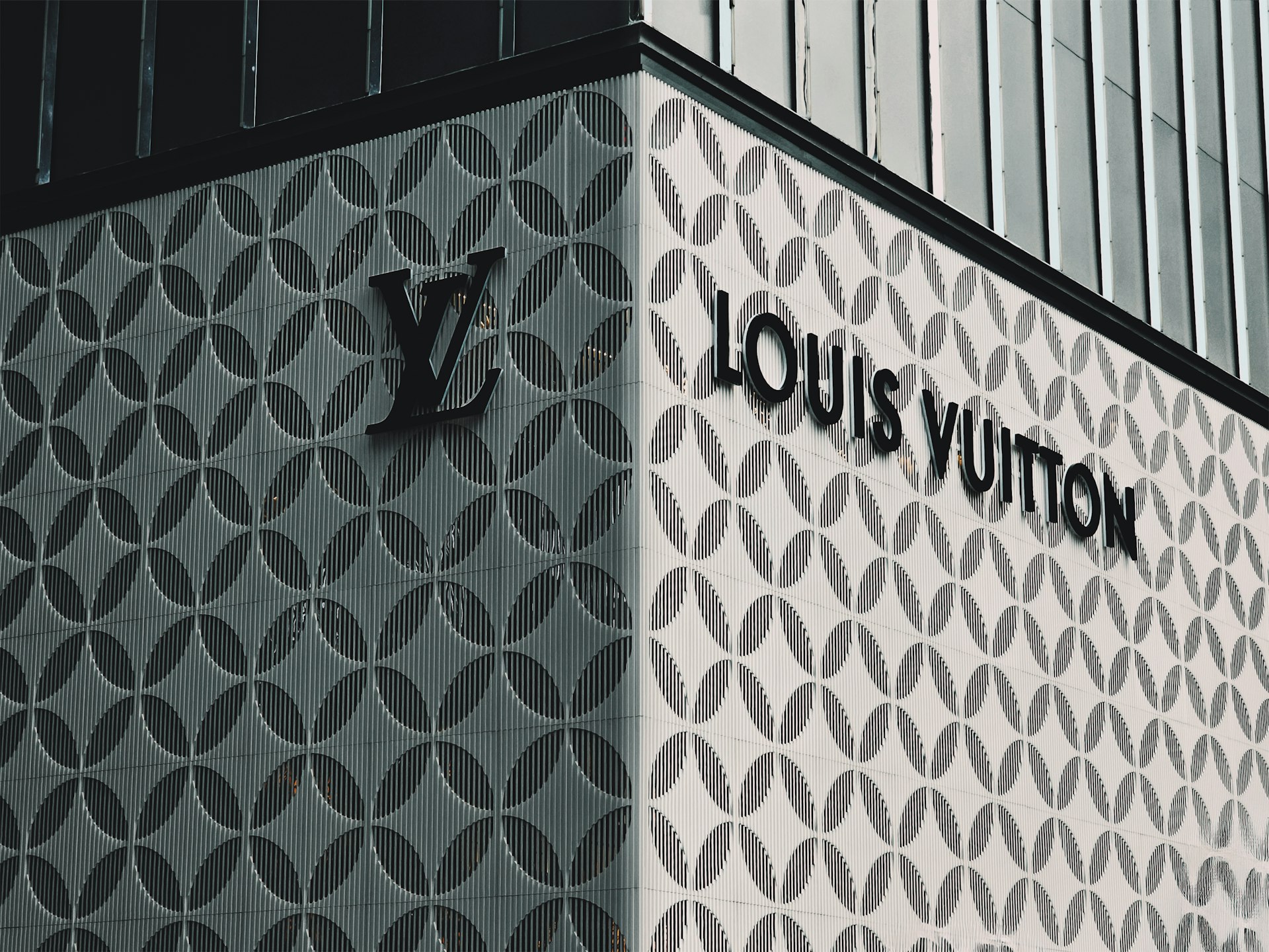 A louis vuitton sign on the side of a building