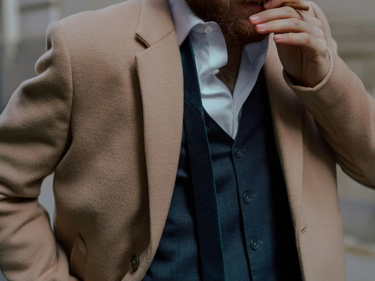 man in brown suit jacket